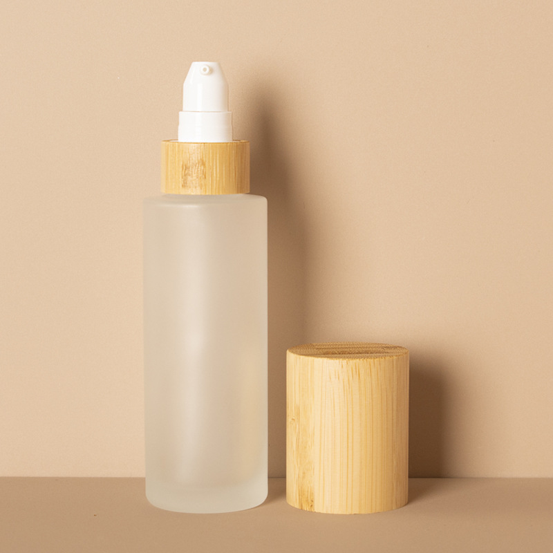 Caidéal Lotion Cosmaideacha Reoite Ceo Mín agus Buidéal Sprae Gloine Lotion Le Clúdach Adhmaid Bambú Caidéal Lotion Cosmaideacha Reoite Ceo Mín agus Buidéal Sprae Gloine Lotion Le Clúdach Adhmaid Bambú