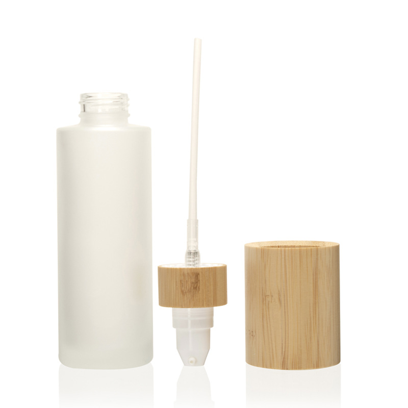 Caidéal Lotion Cosmaideacha Reoite Ceo Mín agus Buidéal Sprae Gloine Lotion Le Clúdach Adhmaid Bambú Caidéal Lotion Cosmaideacha Reoite Ceo Mín agus Buidéal Sprae Gloine Lotion Le Clúdach Adhmaid Bambú