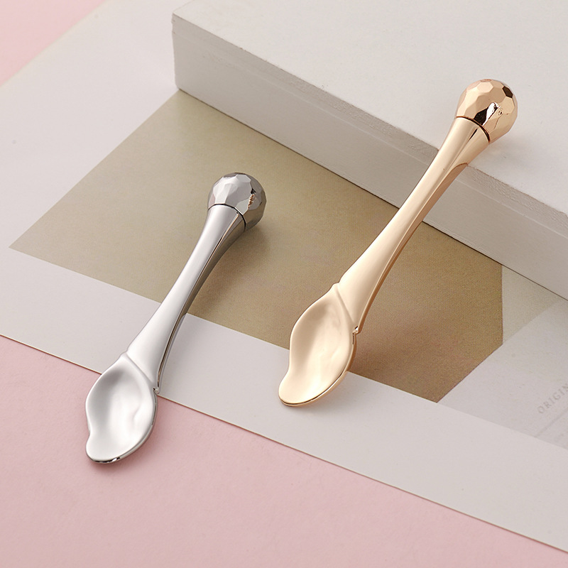 Súl Roller Massage Bata Uachtar Súl Applicator Spatulas Cosmaideacha Spúnóg Aghaidh Frith-Wrinkle Uirlis Cúraim Aghaidh Óir Alloy