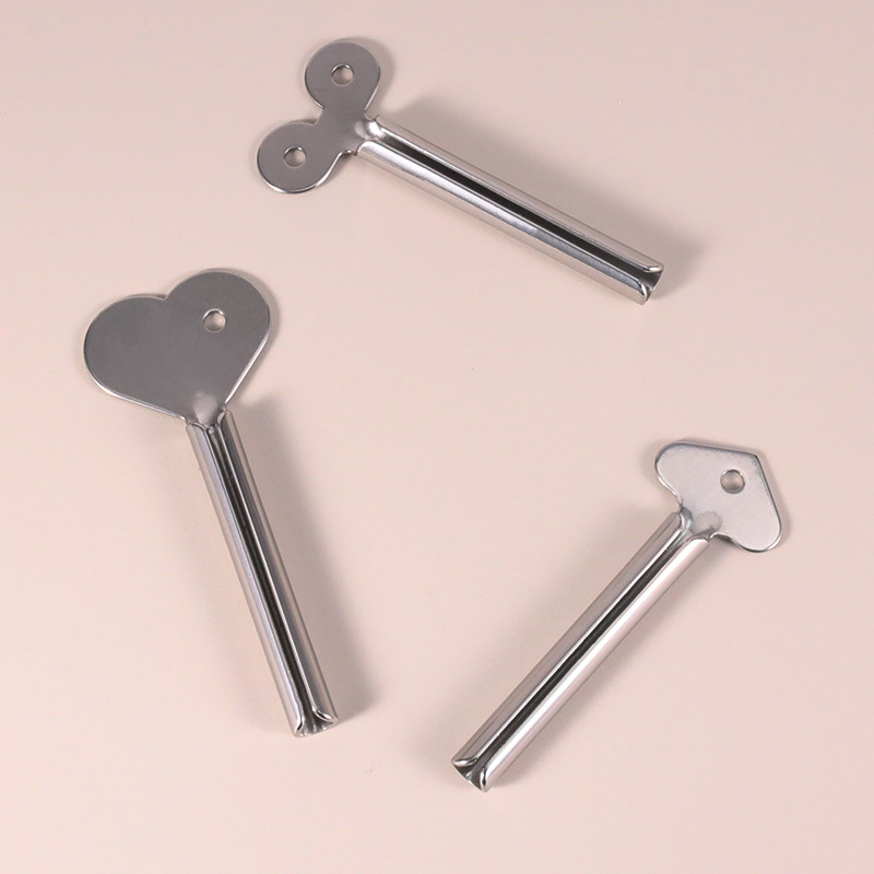 Eochair Toothpaste Roller Feadán Squeezer Feadán Rollta Cruach Dhosmálta Squeezer Feadán Miotail Fáscadh Eochair